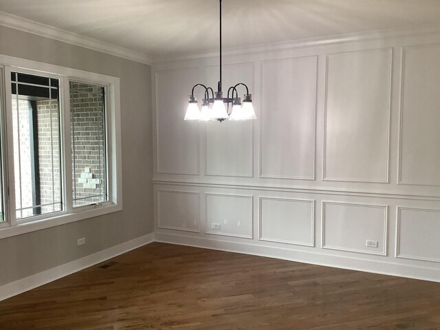 12415 Foxborough Dr, Mokena, IL 60448 - unfurnished dining area featuring a decorative wall, a chandelier, dark wood-style flooring, and crown molding