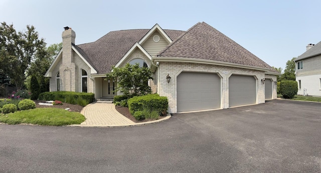 10652 Lexington Ct, Frankfort, IL 60423 - view of front of property featuring brick siding, an attached garage, driveway, and roof with shingles