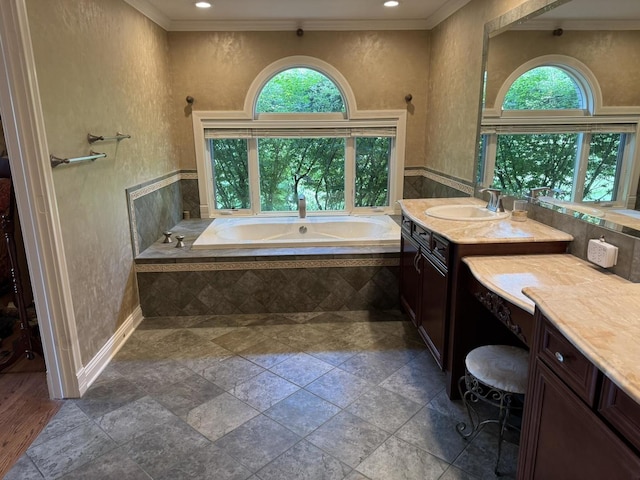 10652 Lexington Ct, Frankfort, IL 60423 - bathroom featuring healthy amount of natural light, a garden tub, crown molding, vanity, and stone tile flooring
