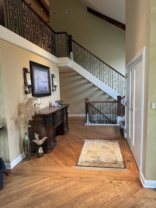 10652 Lexington Ct, Frankfort, IL 60423 - staircase featuring a high ceiling and wood finished floors