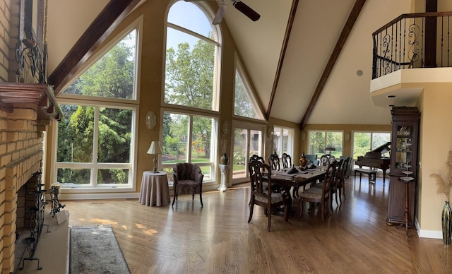 10652 Lexington Ct, Frankfort, IL 60423 - dining room with high vaulted ceiling, beamed ceiling, a ceiling fan, and a brick fireplace