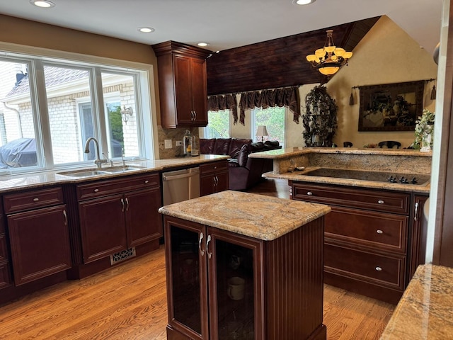 10652 Lexington Ct, Frankfort, IL 60423 - kitchen featuring light wood-type flooring, stainless steel dishwasher, black electric stovetop, recessed lighting, and a center island