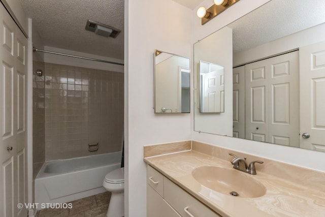 12900 W Heiden Cir Unit 4304, Lake Bluff, IL 60044 - bathroom featuring a textured ceiling, vanity, and tub / shower combination