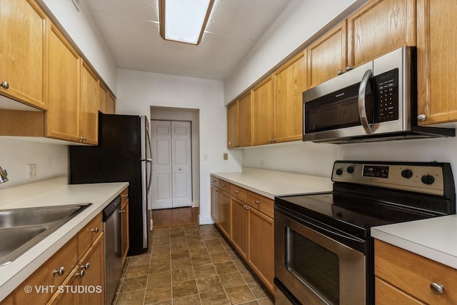 12900 W Heiden Cir Unit 4304, Lake Bluff, IL 60044 - kitchen with appliances with stainless steel finishes, light countertops, and brown cabinets