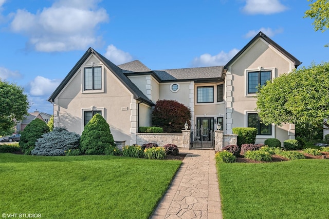 24650 Lincolnway St, Plainfield, IL 60544 - view of front of property with stucco siding, a gate, and a fenced front yard