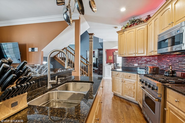 24650 Lincolnway St, Plainfield, IL 60544 - kitchen with appliances with stainless steel finishes, ornamental molding, light brown cabinetry, dark stone counters, and light wood-style flooring