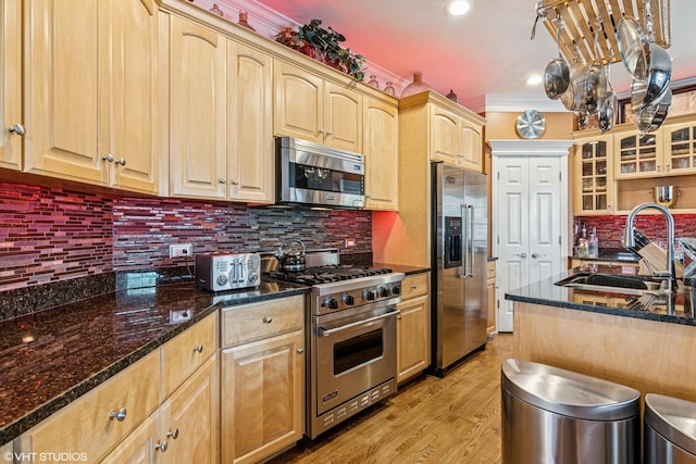 24650 Lincolnway St, Plainfield, IL 60544 - kitchen featuring high end appliances, light brown cabinets, glass insert cabinets, ornamental molding, and recessed lighting