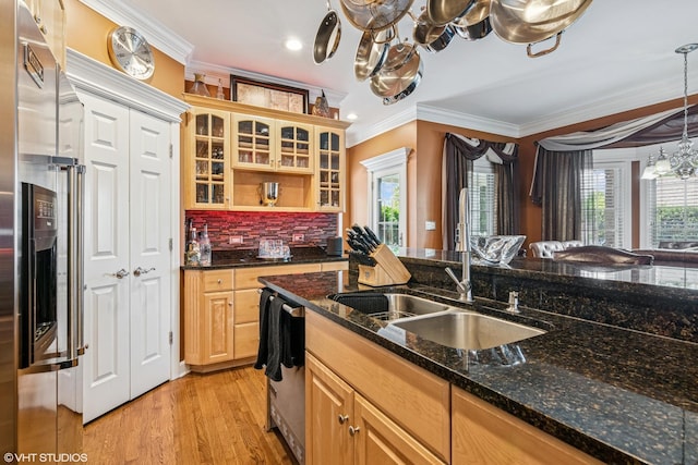 24650 Lincolnway St, Plainfield, IL 60544 - kitchen with crown molding, light wood-type flooring, appliances with stainless steel finishes, glass insert cabinets, and tasteful backsplash