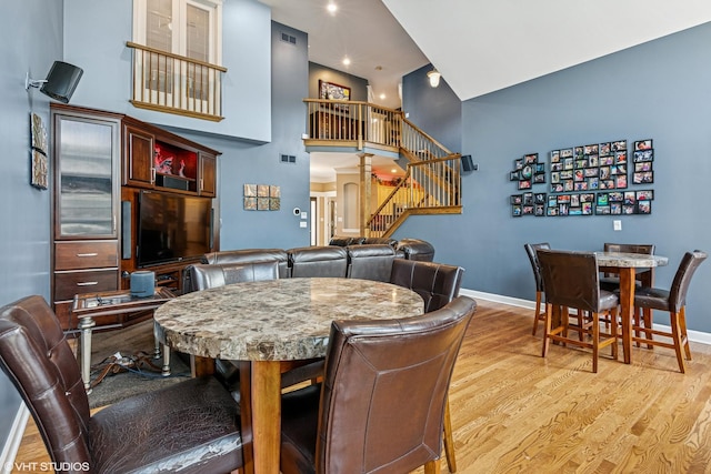 24650 Lincolnway St, Plainfield, IL 60544 - dining area with stairway, light wood-style floors, and a high ceiling