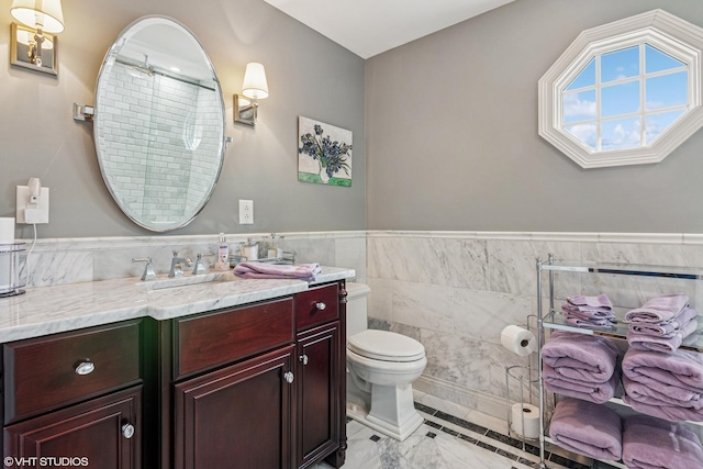24650 Lincolnway St, Plainfield, IL 60544 - bathroom with tile walls, vanity, a wainscoted wall, marble finish flooring, and a shower with door