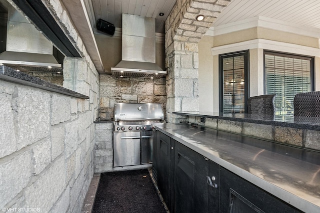 24650 Lincolnway St, Plainfield, IL 60544 - kitchen featuring stainless steel counters, dark cabinets, and wall chimney exhaust hood