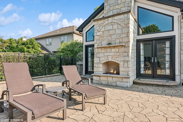 24650 Lincolnway St, Plainfield, IL 60544 - view of patio featuring an outdoor stone fireplace and french doors