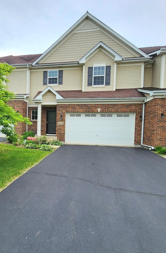 2003 Magenta Ln, Algonquin, IL 60102 - townhome / multi-family property with a garage, driveway, and brick siding