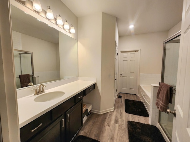 2003 Magenta Ln, Algonquin, IL 60102 - bathroom with wood finished floors, vanity, a garden tub, a shower with shower door, and recessed lighting