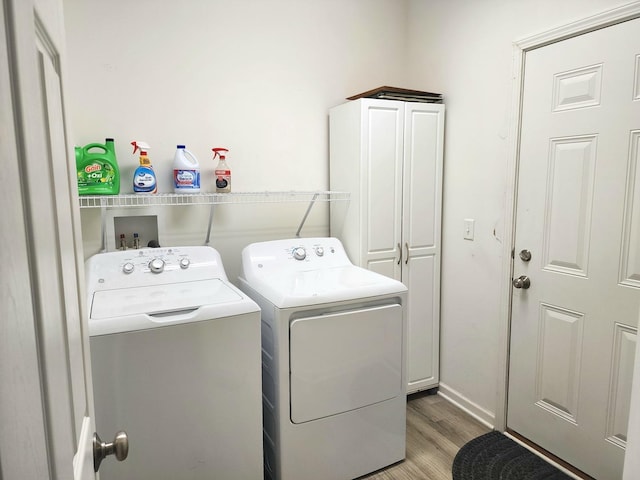 2003 Magenta Ln, Algonquin, IL 60102 - laundry room featuring washing machine and clothes dryer, cabinet space, and light wood-style floors