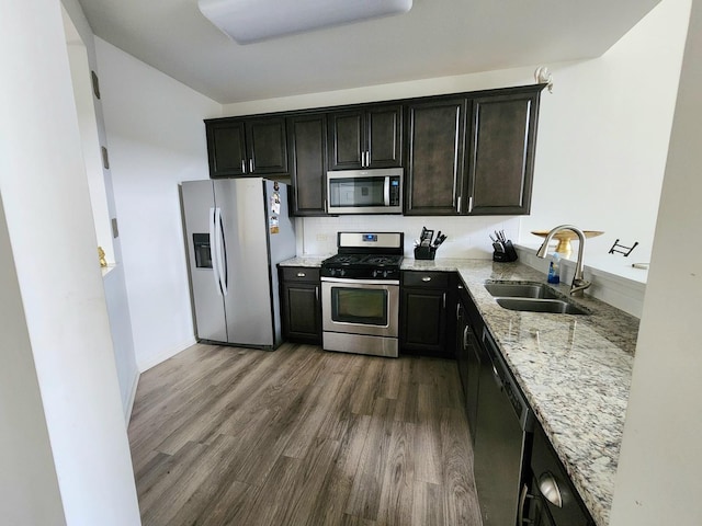 2003 Magenta Ln, Algonquin, IL 60102 - kitchen featuring stainless steel appliances, light stone countertops, and dark wood-type flooring
