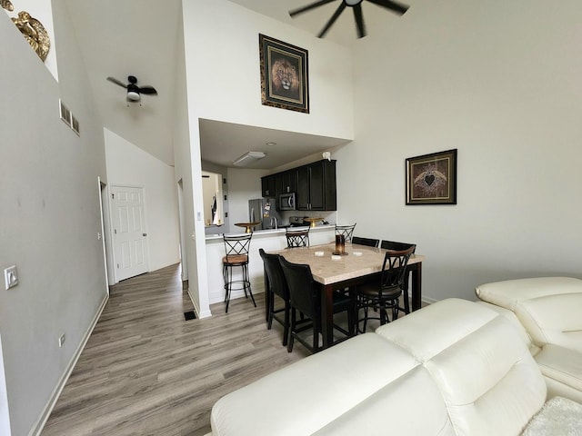 2003 Magenta Ln, Algonquin, IL 60102 - dining area with a towering ceiling, a ceiling fan, and light wood-type flooring