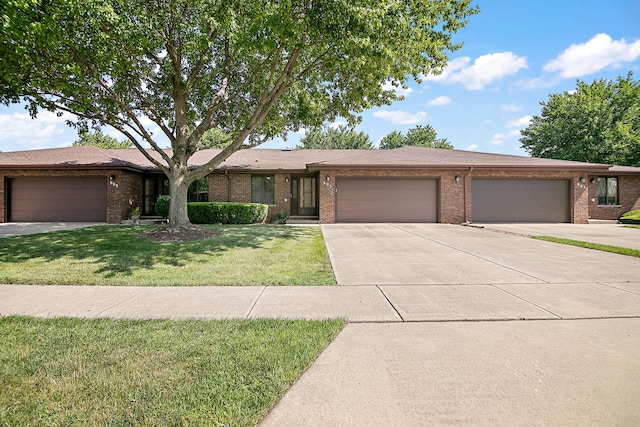 895 Shagbark Rd Unit 44C, New Lenox, IL 60451 - view of front of property with an attached garage, driveway, brick siding, and a front yard
