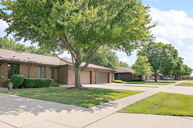 895 Shagbark Rd Unit 44C, New Lenox, IL 60451 - view of front of home featuring brick siding, a garage, concrete driveway, and a front yard