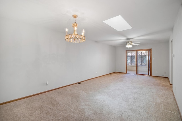 895 Shagbark Rd Unit 44C, New Lenox, IL 60451 - spare room featuring a skylight, light colored carpet, a chandelier, and a ceiling fan