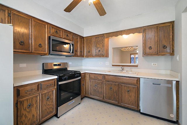 895 Shagbark Rd Unit 44C, New Lenox, IL 60451 - kitchen featuring appliances with stainless steel finishes, a ceiling fan, light countertops, and light floors