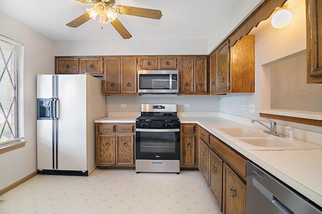 895 Shagbark Rd Unit 44C, New Lenox, IL 60451 - kitchen featuring stainless steel appliances, light countertops, brown cabinetry, and ceiling fan