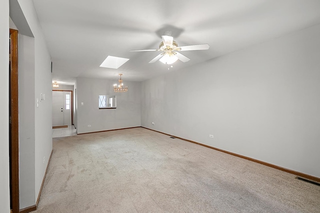 895 Shagbark Rd Unit 44C, New Lenox, IL 60451 - empty room featuring a chandelier, a ceiling fan, light colored carpet, and a skylight