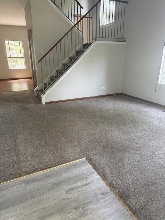 2830 Alameda Ct, Naperville, IL 60564 - unfurnished living room with stairs and carpet