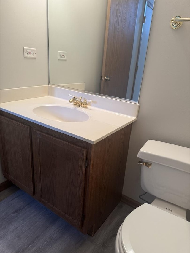 2830 Alameda Ct, Naperville, IL 60564 - half bathroom with vanity and wood finished floors