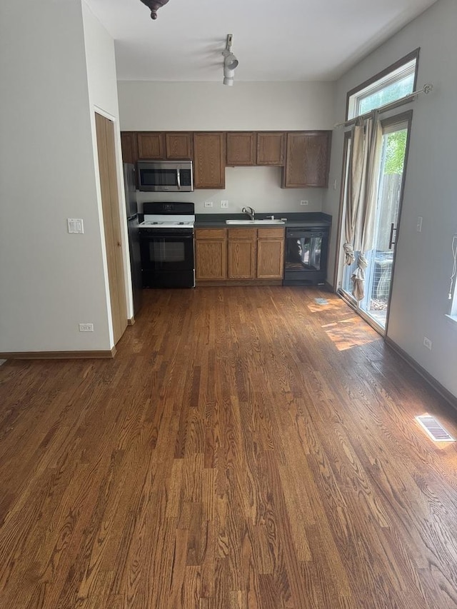2830 Alameda Ct, Naperville, IL 60564 - kitchen with range, stainless steel microwave, dark wood-style floors, and a ceiling fan