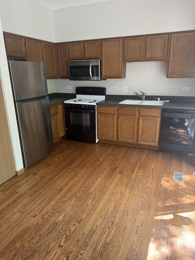 2830 Alameda Ct, Naperville, IL 60564 - kitchen with stainless steel appliances, dark wood-style floors, and dark countertops