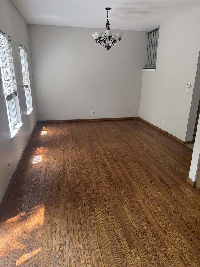 2830 Alameda Ct, Naperville, IL 60564 - empty room featuring a chandelier and dark wood-style flooring