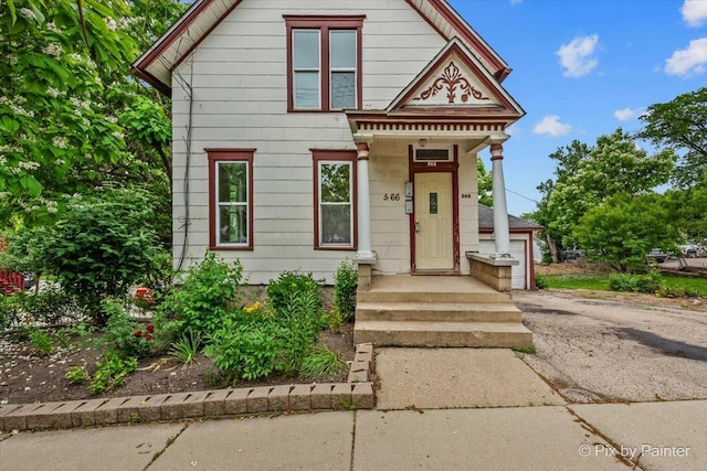 566 Raymond St, Elgin, IL 60120 - view of front of house with a detached garage