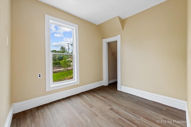 566 Raymond St, Elgin, IL 60120 - empty room featuring baseboards and wood finished floors