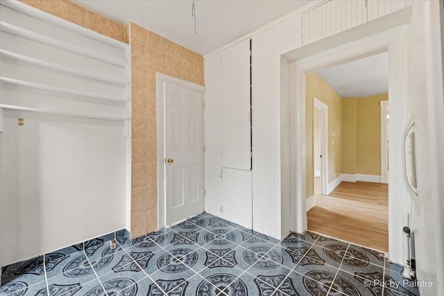 566 Raymond St, Elgin, IL 60120 - hall featuring dark tile patterned floors