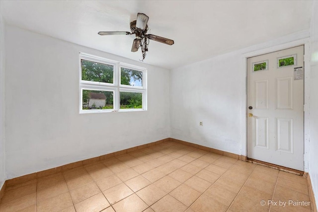 566 Raymond St, Elgin, IL 60120 - unfurnished room featuring ceiling fan and baseboards