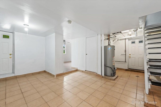 566 Raymond St, Elgin, IL 60120 - interior space with water heater and light tile patterned floors