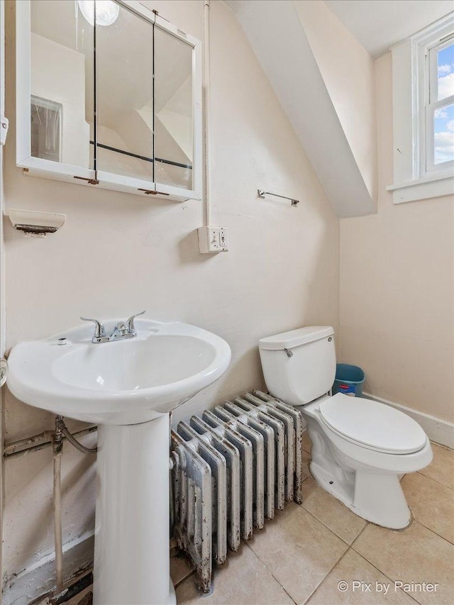 566 Raymond St, Elgin, IL 60120 - bathroom with tile patterned floors and radiator