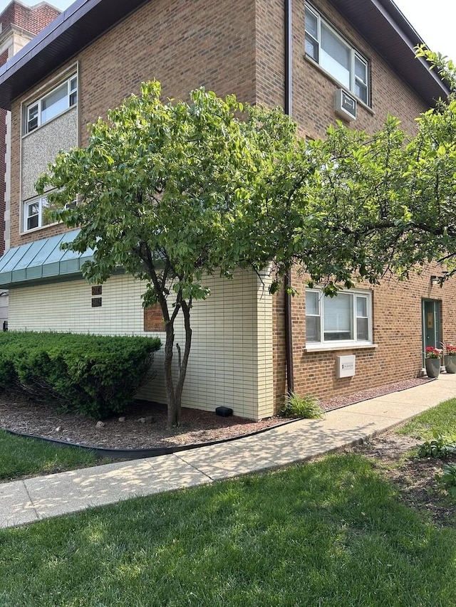 214 S Oak Park Ave Unit 2, Oak Park, IL 60302 - view of home's exterior featuring brick siding