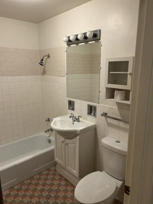214 S Oak Park Ave Unit 2, Oak Park, IL 60302 - full bath with vanity, shower / bath combination, and tile walls