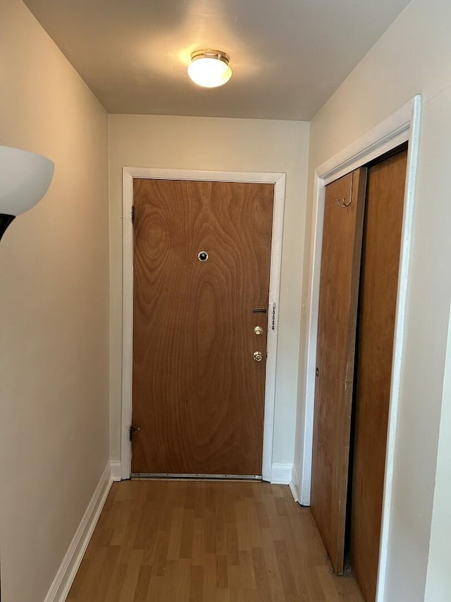 214 S Oak Park Ave Unit 2, Oak Park, IL 60302 - doorway featuring wood finished floors and baseboards