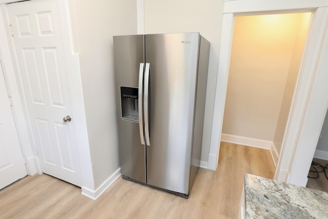 507 Grant Ave, Joliet, IL 60433 - kitchen with stainless steel fridge, light wood finished floors, and light stone countertops