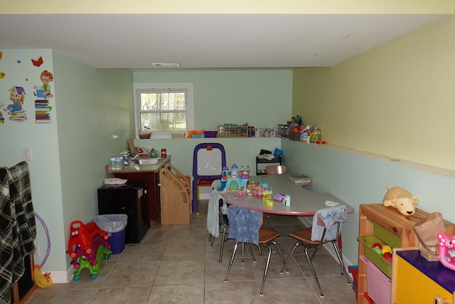 505 Woodmoor Dr, Round Lake Beach, IL 60073 - playroom featuring tile patterned floors and a sink