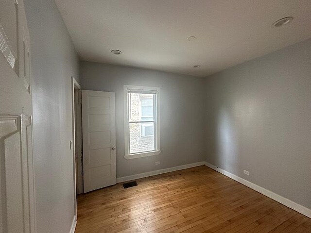 4131 N Monticello Ave, Chicago, IL 60618 - unfurnished room featuring light wood finished floors