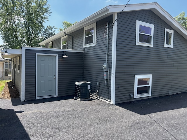 805 Monroe Ave, Carpentersville, IL 60110 - view of property exterior featuring a central AC unit