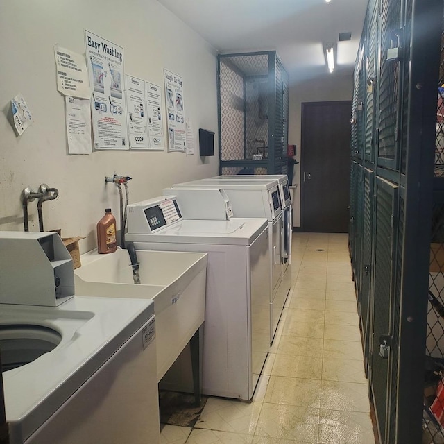 5117 N E River Rd Unit 1A, Chicago, IL 60656 - community laundry room with separate washer and dryer and light tile patterned floors