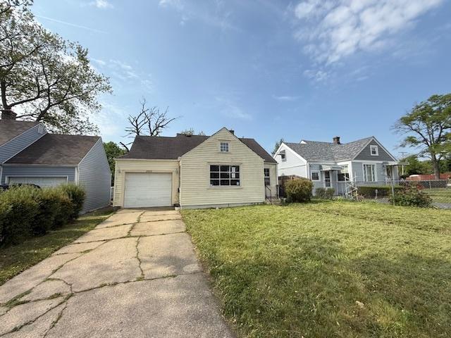 2025 Marshall Pkwy, Waukegan, IL 60085 - view of front of home featuring concrete driveway and an attached garage