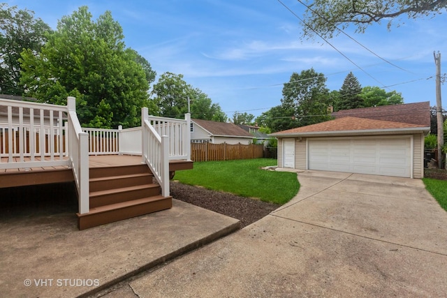 636 S 10th Ave, La Grange, IL 60525 - view of yard with a detached garage, a deck, and an outbuilding
