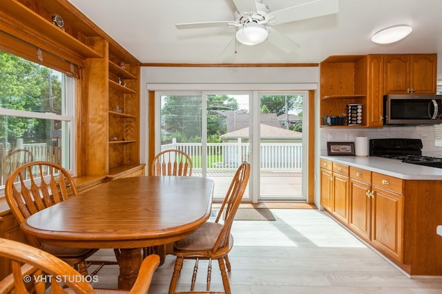 636 S 10th Ave, La Grange, IL 60525 - dining area with healthy amount of natural light, light wood-style flooring, a ceiling fan, and ornamental molding