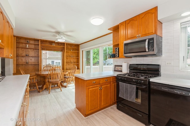 636 S 10th Ave, La Grange, IL 60525 - kitchen featuring black appliances, a peninsula, light countertops, a ceiling fan, and open shelves